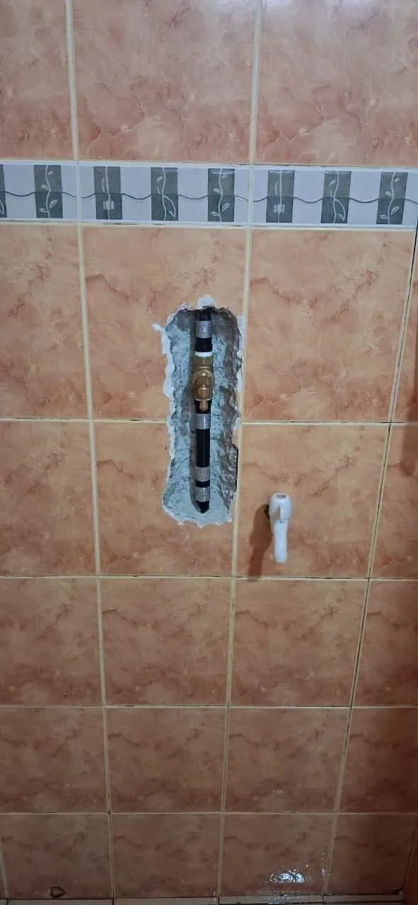 Concealed wall pipe exposed for a focused repair