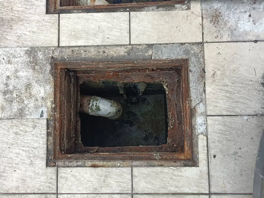 Underground drain chamber opened for inspection